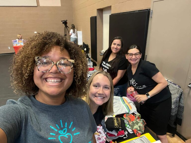 Employees smiling from Sunrise Children’s Foundation while teaching early childhood education.