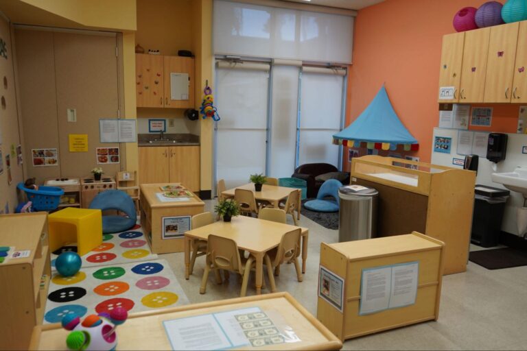 Colorful and inviting early childhood education classroom, equipped with educational toys, small chairs, and tables, designed to support early childhood education careers.