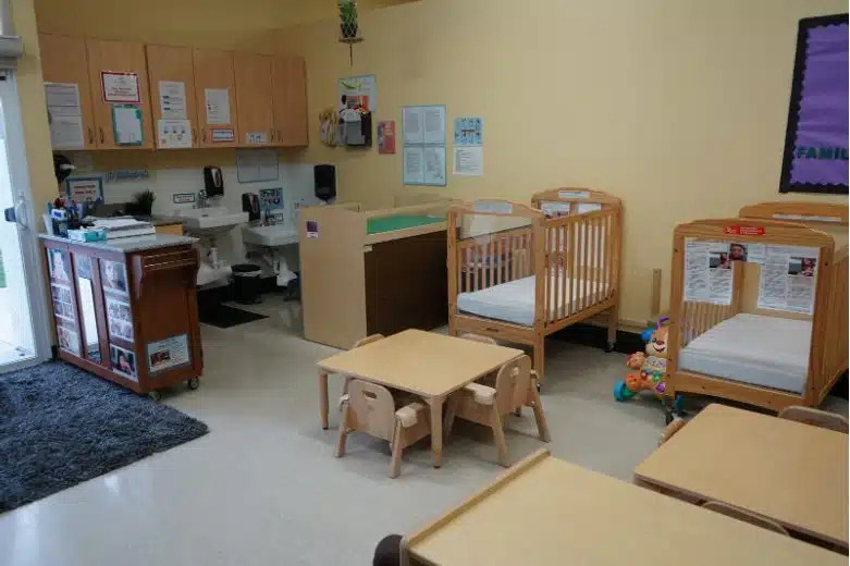 Bright and organized early childhood classroom with cribs and small tables, highlighting head start employment opportunities and the role of a head start education coordinator.