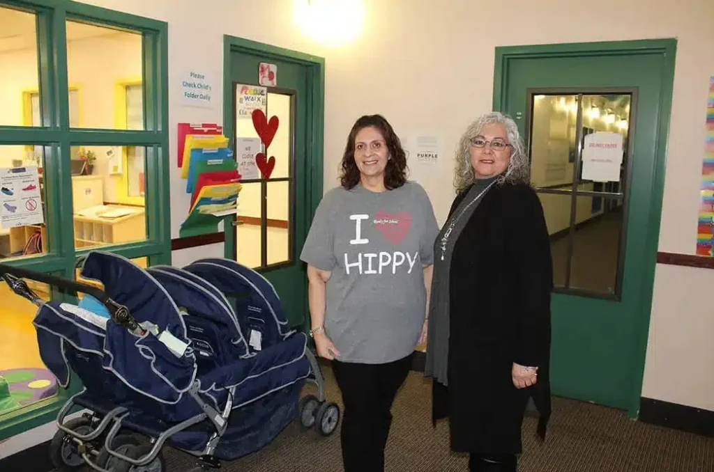 two ladies standing inside Sunrise Children's Foundation
