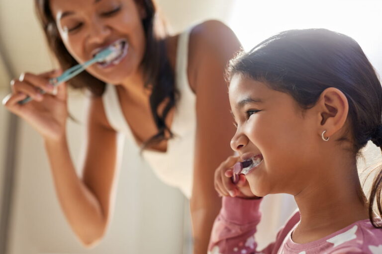 child and mother brushing teeth in las vegas