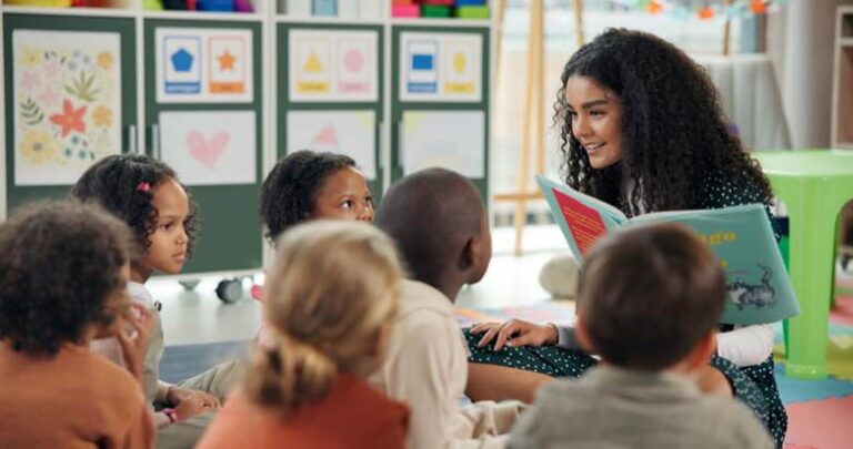A Head Start teacher reads to her classroom.